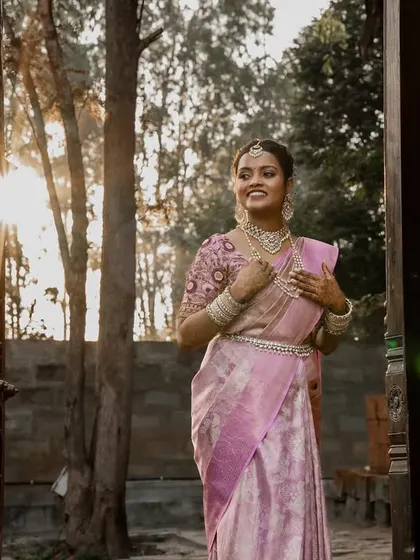A bride basking in the golden hour glow. We chase beautiful light to create artistic portraits like this one of Aishwarya, capturing her radiance and joy as she steps into a new beginning at The Peacock Grove.