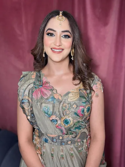 A stunning party makeup look with soft, defined eyes and a neutral lip, paired with beautifully styled waves.