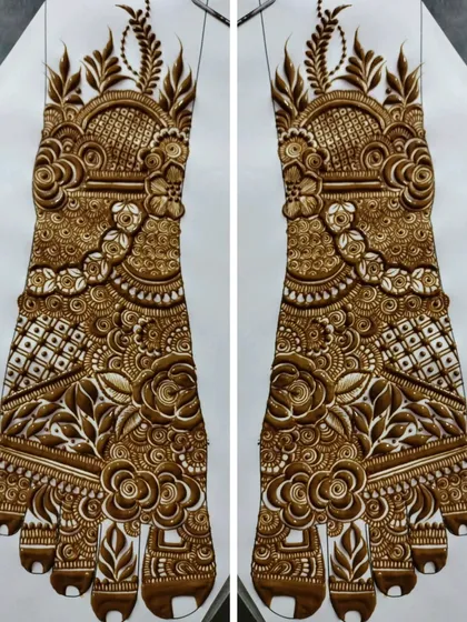 A stunning, symmetrical bridal foot design. Creating a perfectly mirrored design for the feet is a hallmark of a professional artist.