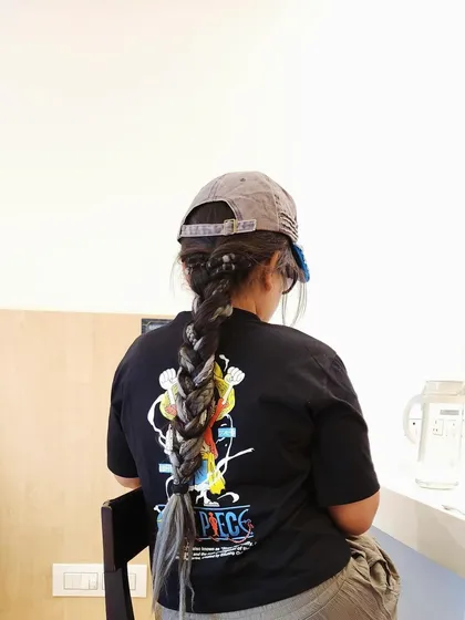 Dreadlocks can be styled in so many ways. Here, I've created a thick, intricate braid for a client, a perfect way to manage long locs for a clean, elegant look that's great for any occasion.