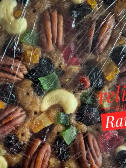 This is a close-up of my traditional Christmas plum cake. You can see how it's loaded with premium nuts like pecans and cashews, and a variety of fruits that I soak for months in rum for that authentic, rich flavour.