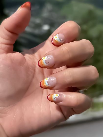 My client went on vacation and sent back these amazing photos of the egg-themed nails I did for her two weeks prior. It's great to see my work enjoyed around the world.