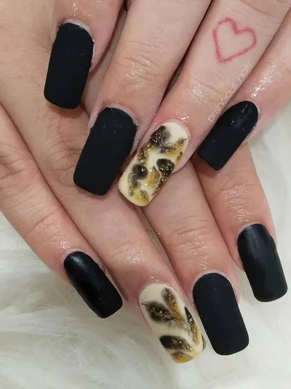 Another view of the matte black and marble manicure. The contrast between the matte finish and the shimmery marble is stunning.