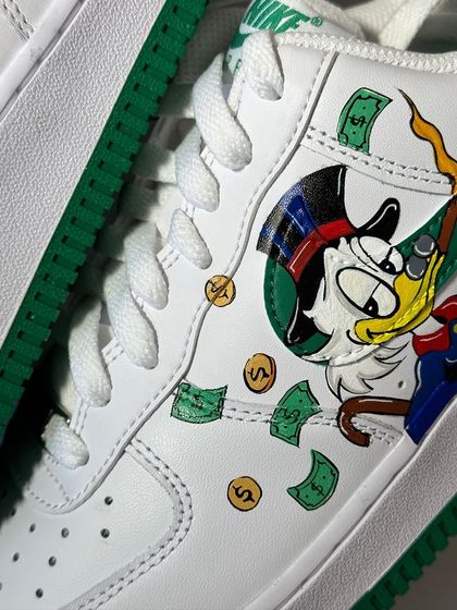 A macro shot of the Scrooge McDuck artwork on the custom AF1s.
