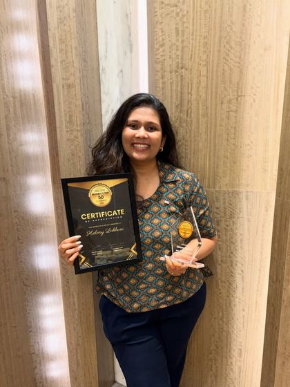 A duplicate of image 14, showing me proudly holding my certificate and trophy for being named one of Mumbai's Top 50 Bakers.