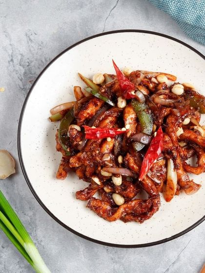 Our spicy chicken stir-fry, loaded with peanuts, dried red chillies, and bell peppers. This dish packs a punch and is full of texture.