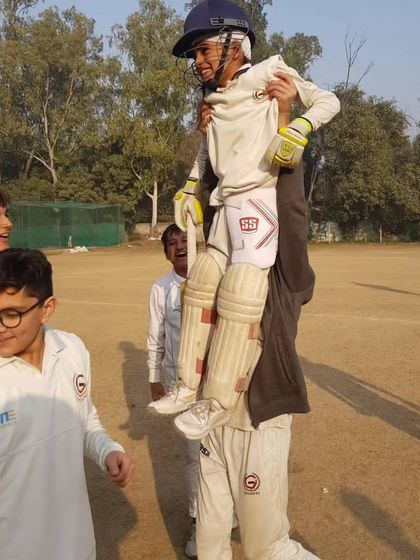 The pure joy of celebration. A player is carried on the shoulders of his teammate after a great performance.