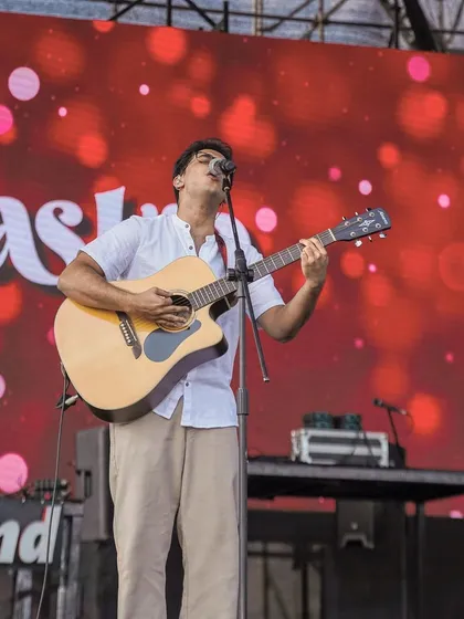 Another shot of me on the acoustic guitar at Zomaland. We tailor our setlist to include both high energy band songs and stripped back acoustic numbers to keep the audience engaged.