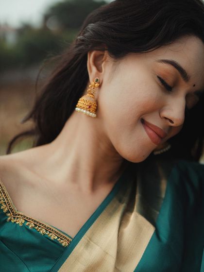 A serene portrait of Mirnalini. The soft makeup and her gentle expression create a timeless and beautiful image.