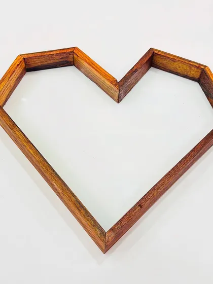 This geometric heart-shaped teakwood frame is perfect for creating a unique varmala preservation piece or a romantic gift. Its sturdy construction and 10x15 inch size provide a great canvas for your resin art.
