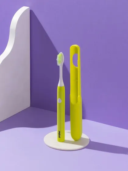 Color blocking can make a product pop. For this electric toothbrush, we used a bold purple background and contrasting props to create a graphic, eye-catching image.