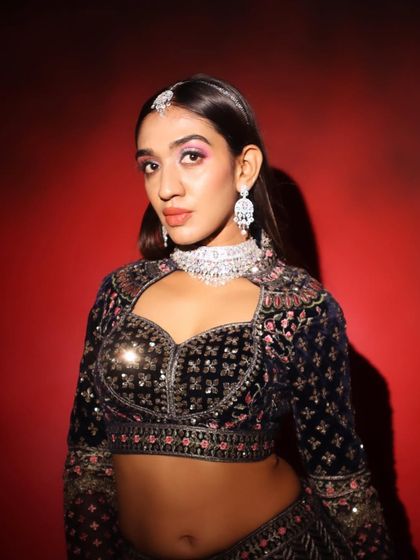 A close-up of the modern party makeup. The diamond choker and pink eyeshadow create a chic and trendy look.