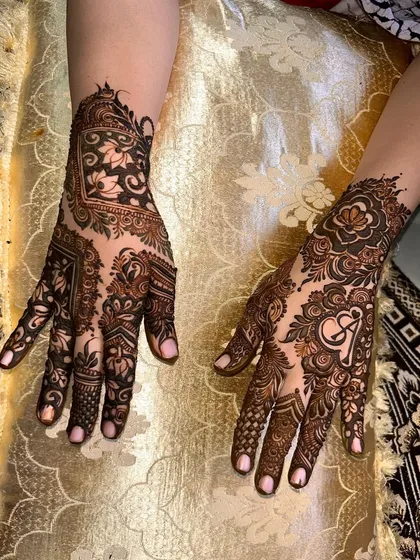 This design shows how I can create different but complementary patterns on each hand, one with a geometric focus and the other with a heart initial.