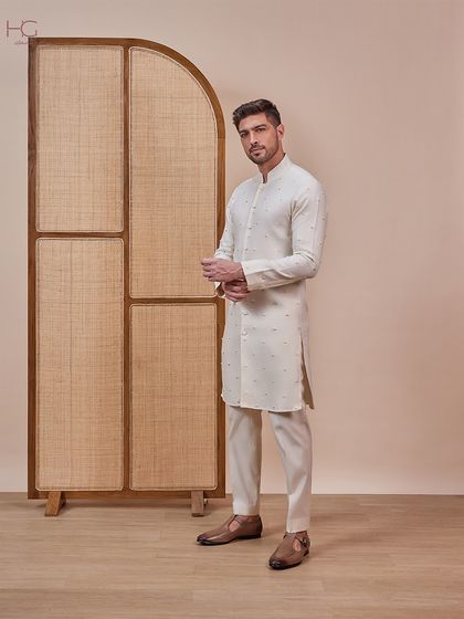This cream ensemble is a versatile choice for a Haldi or Mehendi. The kurta features subtle, sparse embroidery for a touch of minimalist elegance.