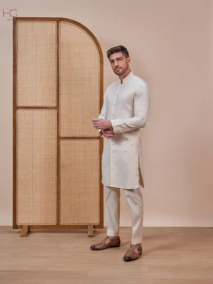 This cream ensemble is a versatile choice for a Haldi or Mehendi. The kurta features subtle, sparse embroidery for a touch of minimalist elegance.