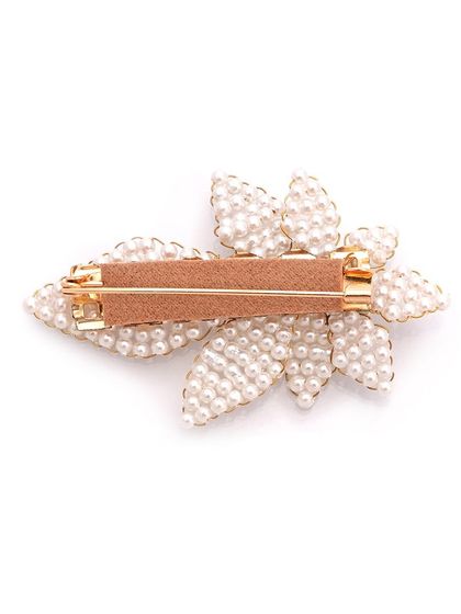Brooches have long been associated with royalty. This is the back of our pearl leaf brooch, showing the secure clip.