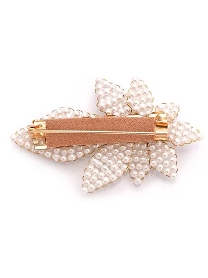 Brooches have long been associated with royalty. This is the back of our pearl leaf brooch, showing the secure clip.