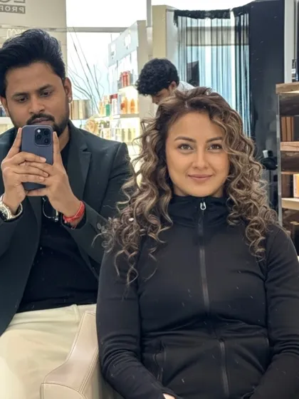 A selfie with my happy client, showing off her new dimensional color on her beautiful curls.