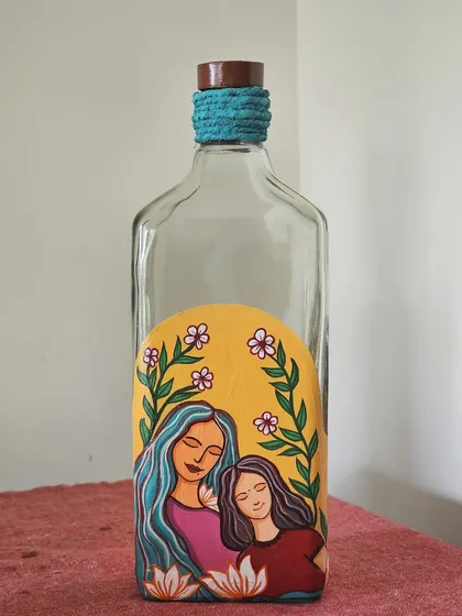 Another beautiful bottle from our Mother's Day workshop, featuring a mother and daughter surrounded by flowers.