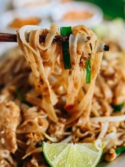 A tempting close-up of Pad Thai noodles, showcasing the fresh ingredients and authentic flavors of this classic dish from our Asian Week menu.