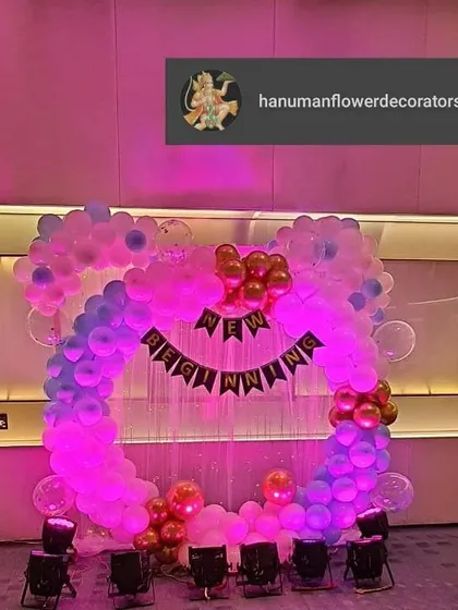 For a corporate event celebrating a "New Beginning" at Vivanta Taj, we designed this fun and modern circular balloon arch. The pink and purple lighting adds to the celebratory mood, showing our versatility with different decor styles.