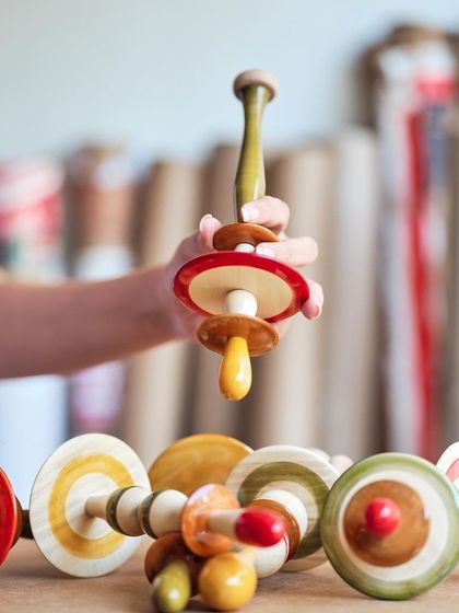 Assembling the Channapatna modules for the Lucky Chan ceiling installation. Each piece is handcrafted from wood and colored with 100% natural, organic dyes, a traditional technique passed down since the 1700s.