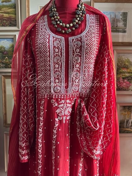A mannequin shot providing a clear perspective of the Anarkali's silhouette and how the dupatta drapes over the shoulders.