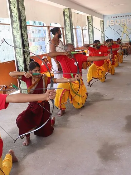 Students of different ages and genders practice together in a line, demonstrating the inclusive nature of the Gurukul. I oversee their form, ensuring each student develops a strong foundation.