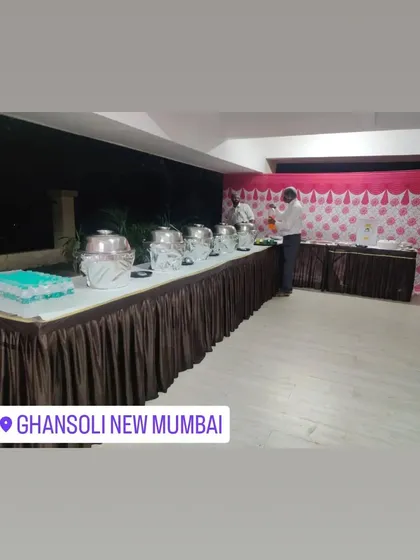 A buffet setup for a birthday party in Ghansoli, New Mumbai. The cake is placed at the end of the buffet line.