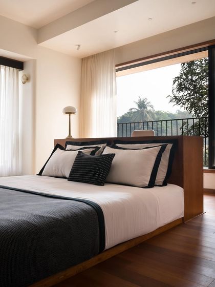 In this bedroom, the study table seamlessly transitions into the platform bed. This integrated design is a solution I use to create an uncluttered perimeter and maximize floor space in smaller rooms.