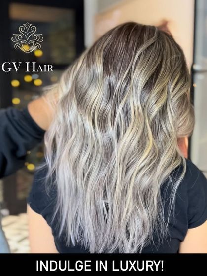 Indulge in luxury. This icy blonde balayage is a statement look, perfect for those who want to stand out.