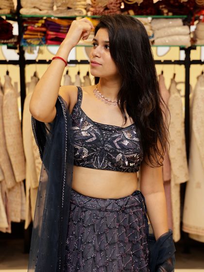 This deep blue lehenga is perfect for a cocktail or reception night. The blouse and skirt are covered in sequins and intricate beadwork that catch the light beautifully.