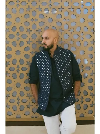 A close-up of my Sangeet outfit against a patterned wall in Marrakech. The details matter, from the music to the fashion.