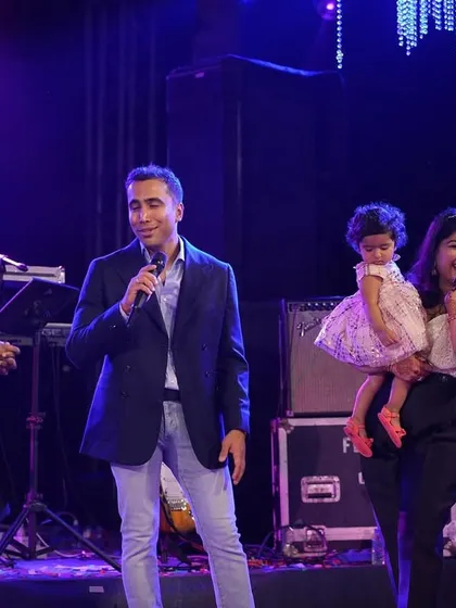 A heartwarming moment on stage with the family. I believe in celebrating not just the couple, but the union of two families.