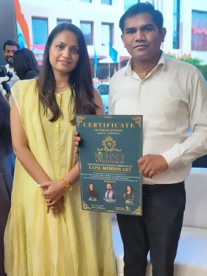 Posing with my certificate. I am grateful for every opportunity to showcase my art and learn from the best in the industry.