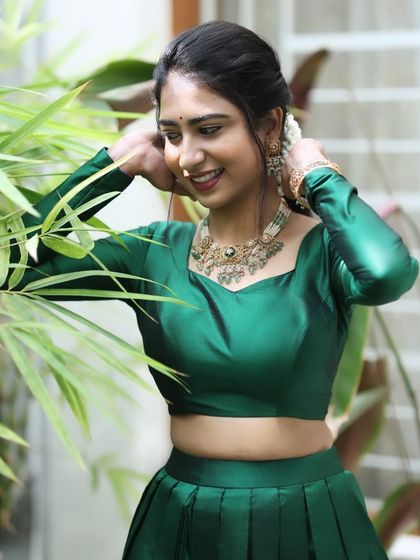 A candid, happy shot of Mahima. Her natural makeup look is perfect for a daytime family event.