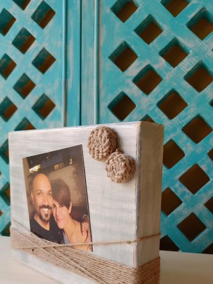 A close-up of a wooden photo block, showing how a simple family picture becomes a piece of decor. The jute details add a lovely, tactile element.
