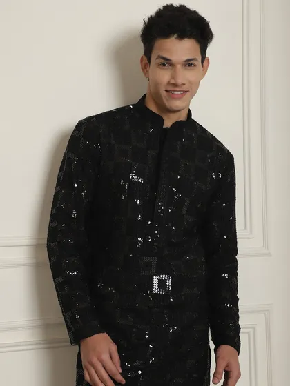 Black and its hues. This black sequined kurta makes you stand out at any sangeet or mehndi night. It's effortless, high on style, and glamorous.