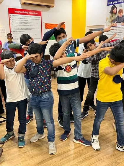 The party doesn't stop at the shooting lanes. Here are our young guests from a birthday bash, full of energy and striking a fun pose after their session. We make sure there's plenty of room for music, dance, and celebration.
