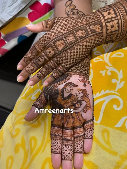 A closer look at a custom baby shower mehandi. This hand shows a beautiful portrait of the expecting couple, a sweet memory to cherish before the baby arrives.