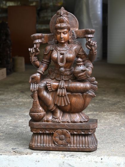 A full view of the 36-inch MahaLakshmi holding money pots, a powerful symbol of abundance.