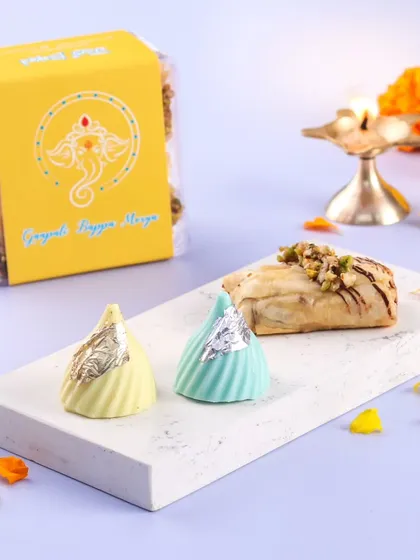 A small box of sweet bliss for Ganesh Utsav, featuring our chocolate modaks and baklava rolls.