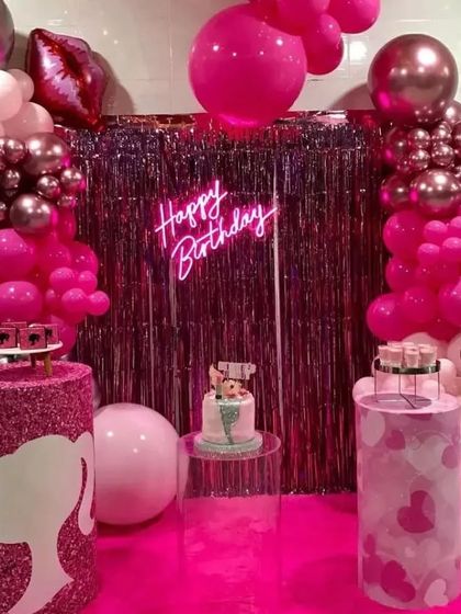 This Barbie-themed setup is all about the glam. We used a pink foil curtain backdrop, a neon sign, and custom-designed pedestals with the iconic Barbie silhouette to create the perfect photo opportunity.