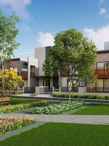 This street-level view of AIPL Dream City NXT showcases the varied facade treatments and personalized feel of the homes. The design ensures that even in a large community, each residence feels unique and personal.
