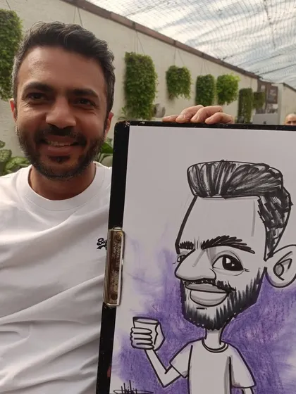 A guest enjoying a drink, captured in his caricature at Elephant and Co.