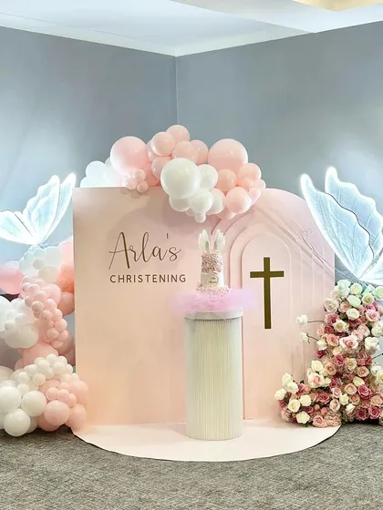 I believe in celebrating sacred moments with grace and elegance. This christening setup uses a soft peach and white palette, illuminated butterflies, and delicate florals to create a serene and beautiful ambiance for your family's special day.