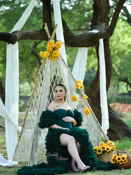 Another angle of the beautiful boho-chic setup, showing the expectant mother seated comfortably in the teepee. This demonstrates the complete and picturesque scene I create for outdoor sessions.