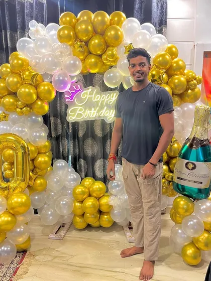 I always make sure the final setup is perfect. Here I am with the completed 50th birthday decor.