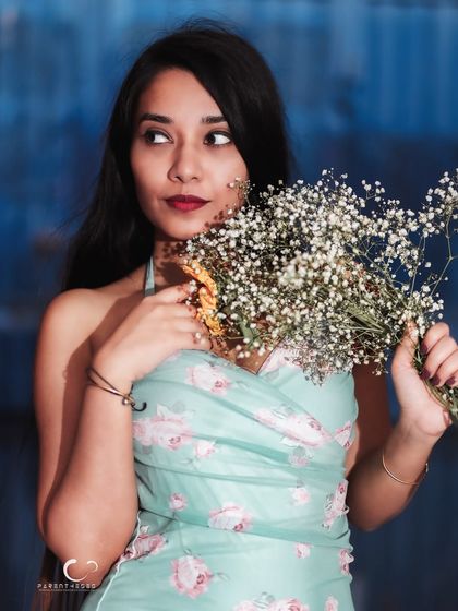 A thoughtful glance away from the camera. The composition is beautiful, and her expression tells a story of daydreams and quiet hopes.