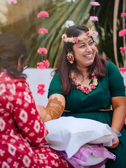 A duplicate of 247, capturing the genuine connection and fun of a mehndi session.